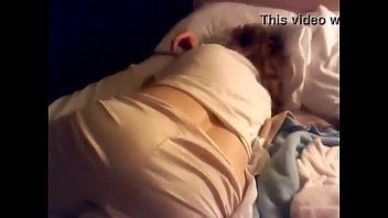 Son has fun with sleeping mom