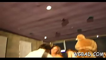 Hawt stripper is getting his cock sucked by several women