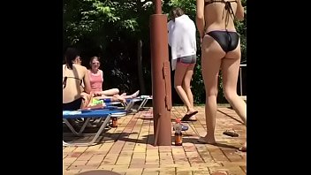 sexy teen walking in bikini near pool