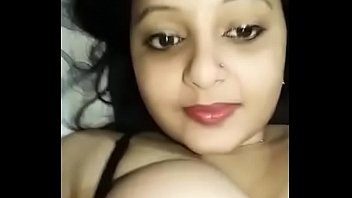 horny indian woman sucks own boobs