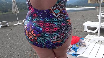 bbw with big booty in tight jeans is dressing in a public dressing room on the beach fetish